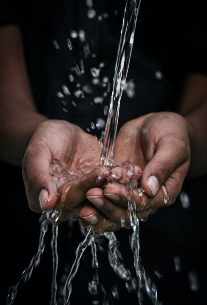 clean water flowing onto hands